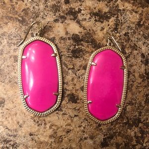 Hot pink Kendra Scott earrings.